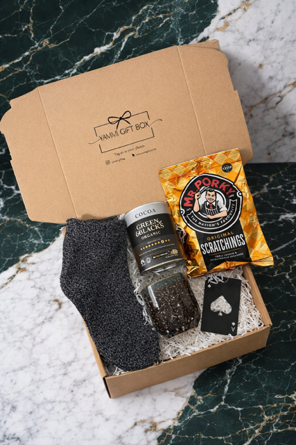 men's gift box with socks, cup, and ediable treats