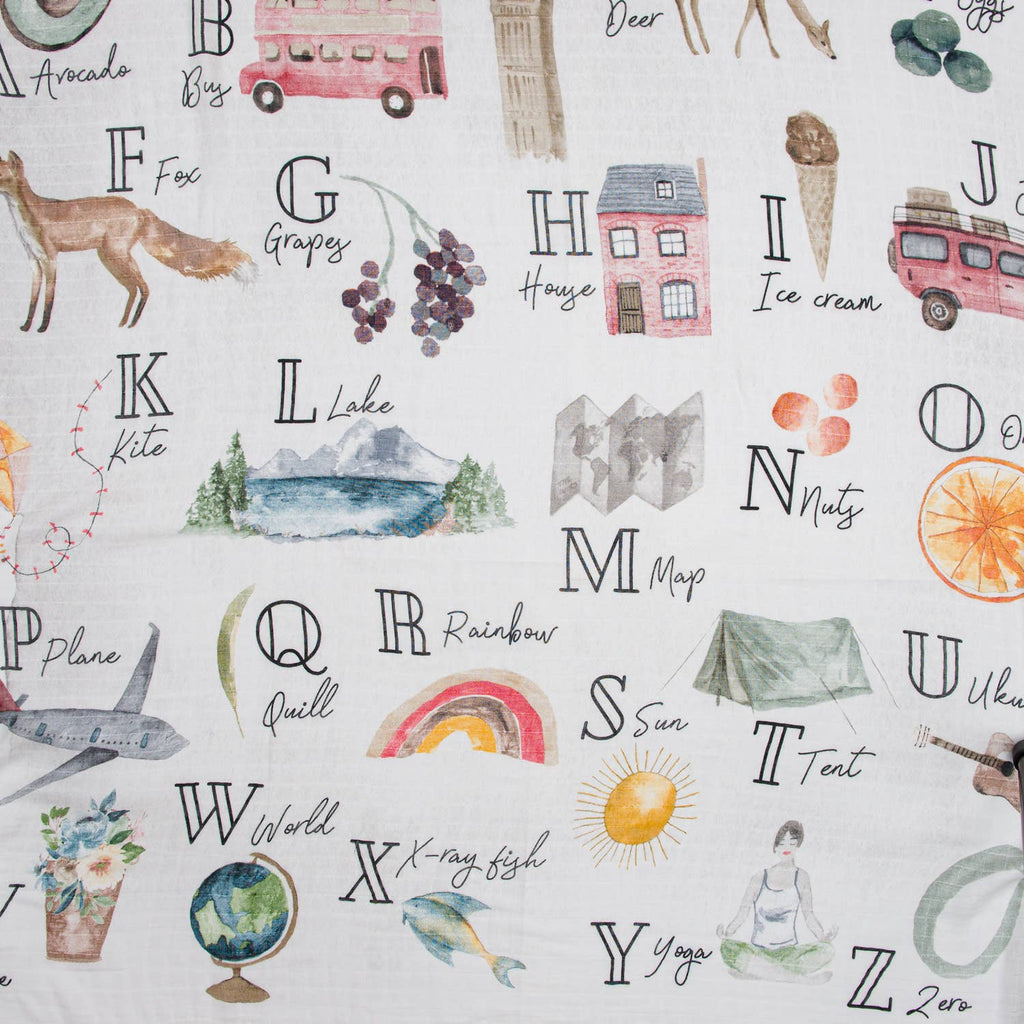 Alphabet-themed fabric with illustrations and text on a white background