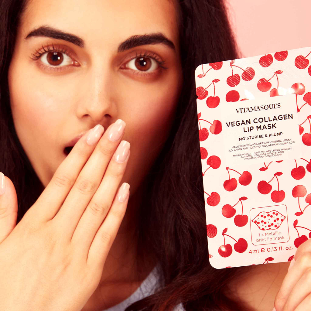 Woman holding a lip mask with cherry design and text