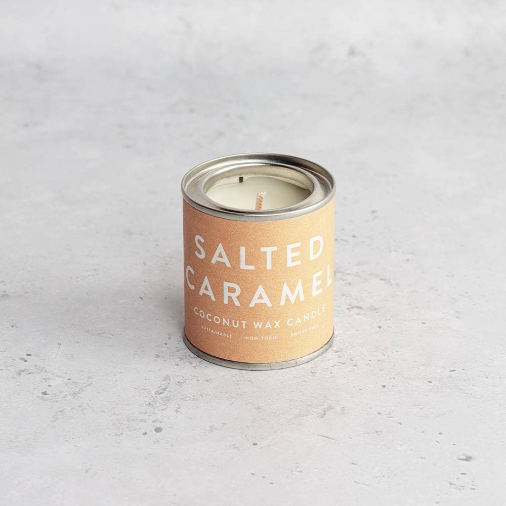Candle in a can labeled 'Salted Caramel'.
