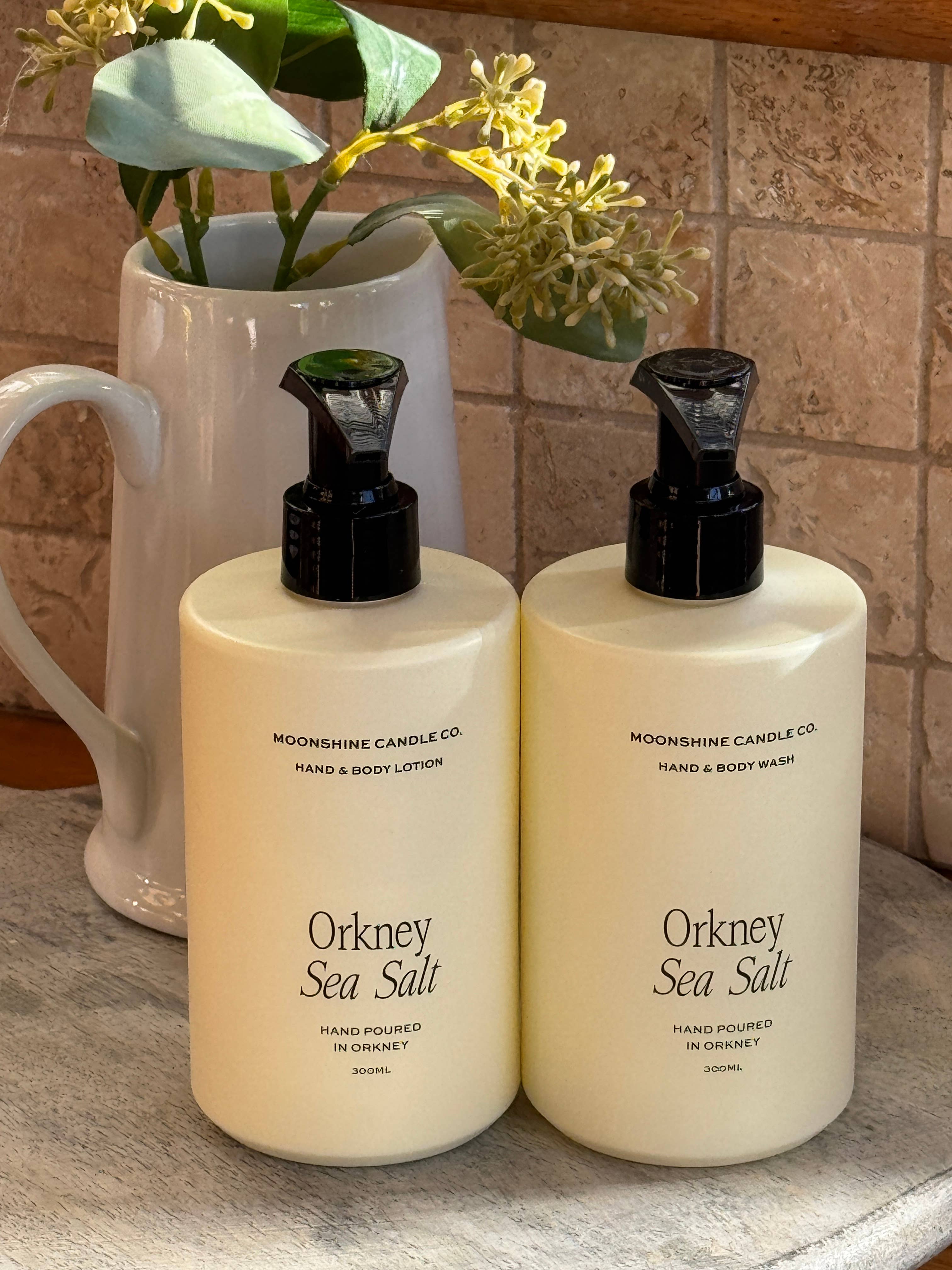 Two bottles of Orkney Sea Salt hand and body products.