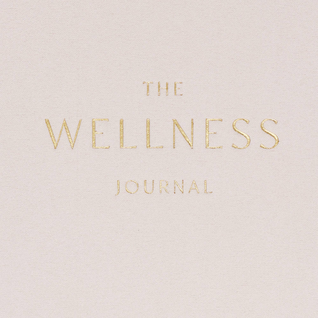 Cover of 'The Wellness Journal' with gold text.