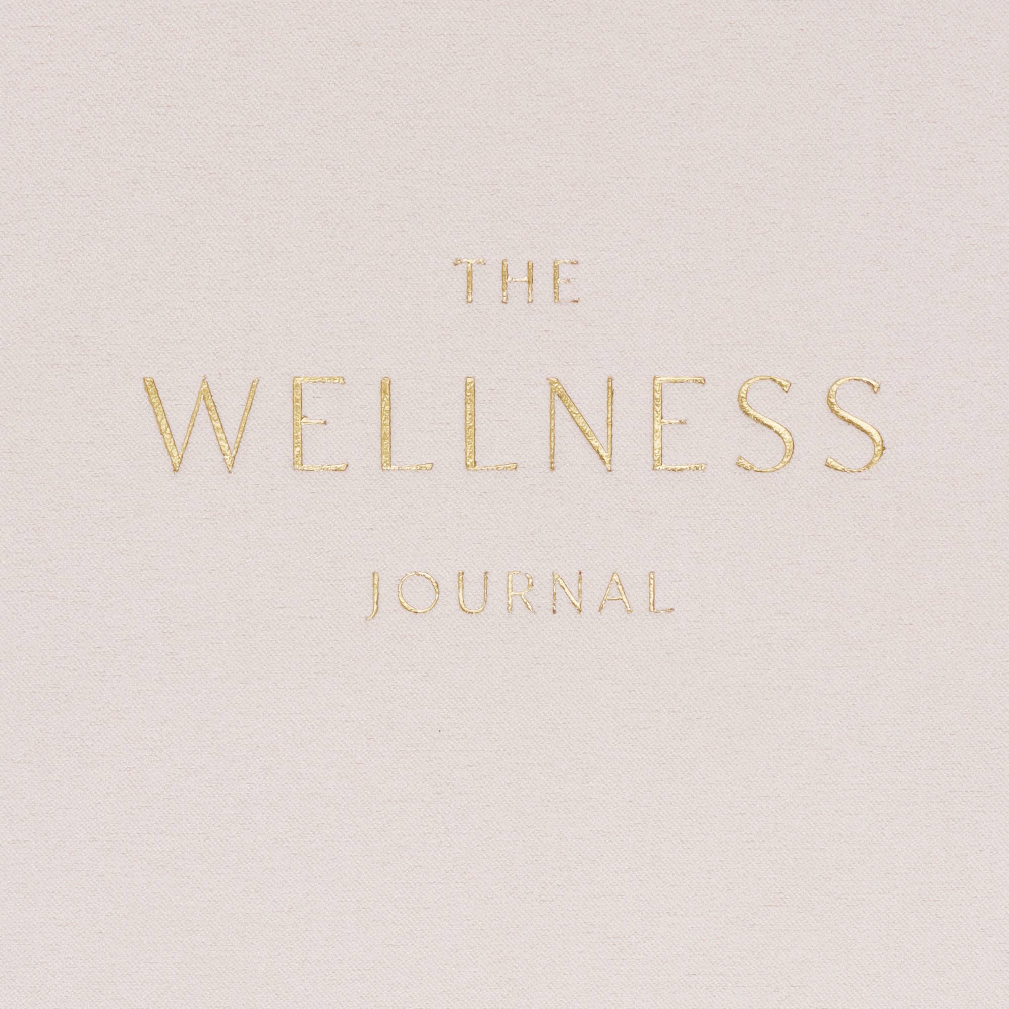 Cover of 'The Wellness Journal' with gold text.