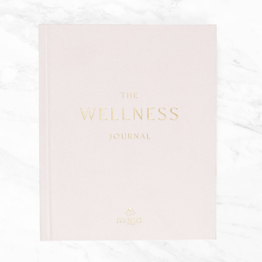 Pink journal titled 'The Wellness Journal'.