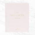 Pink journal titled 'The Wellness Journal'.