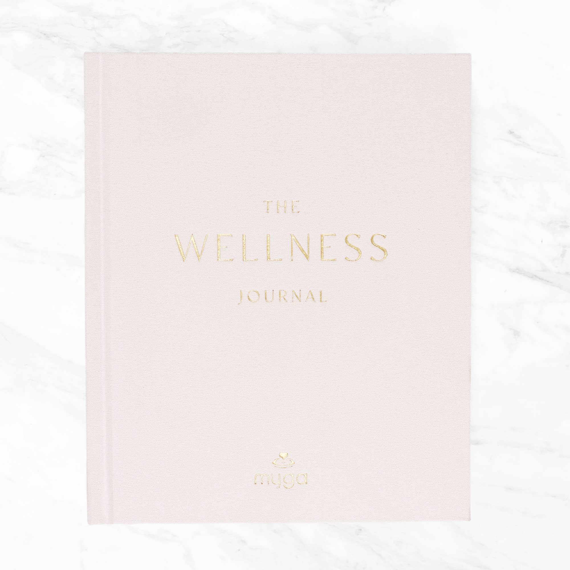 Pink journal titled 'The Wellness Journal'.