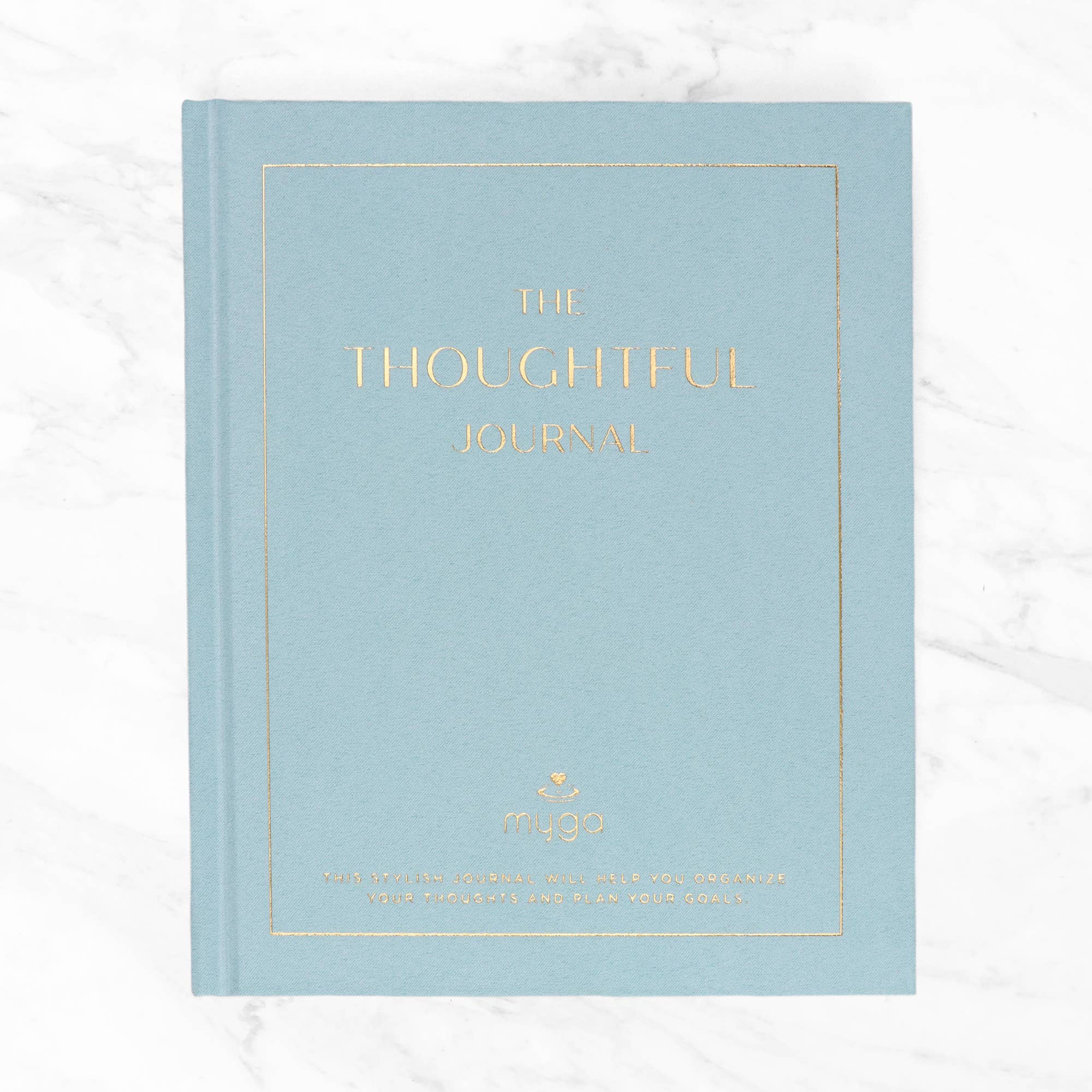 Light blue journal with 'The Thoughtful Journal' text in gold.
