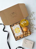 blind date with a book gift box with eye maks, bath bomb and gold satin scrunchie