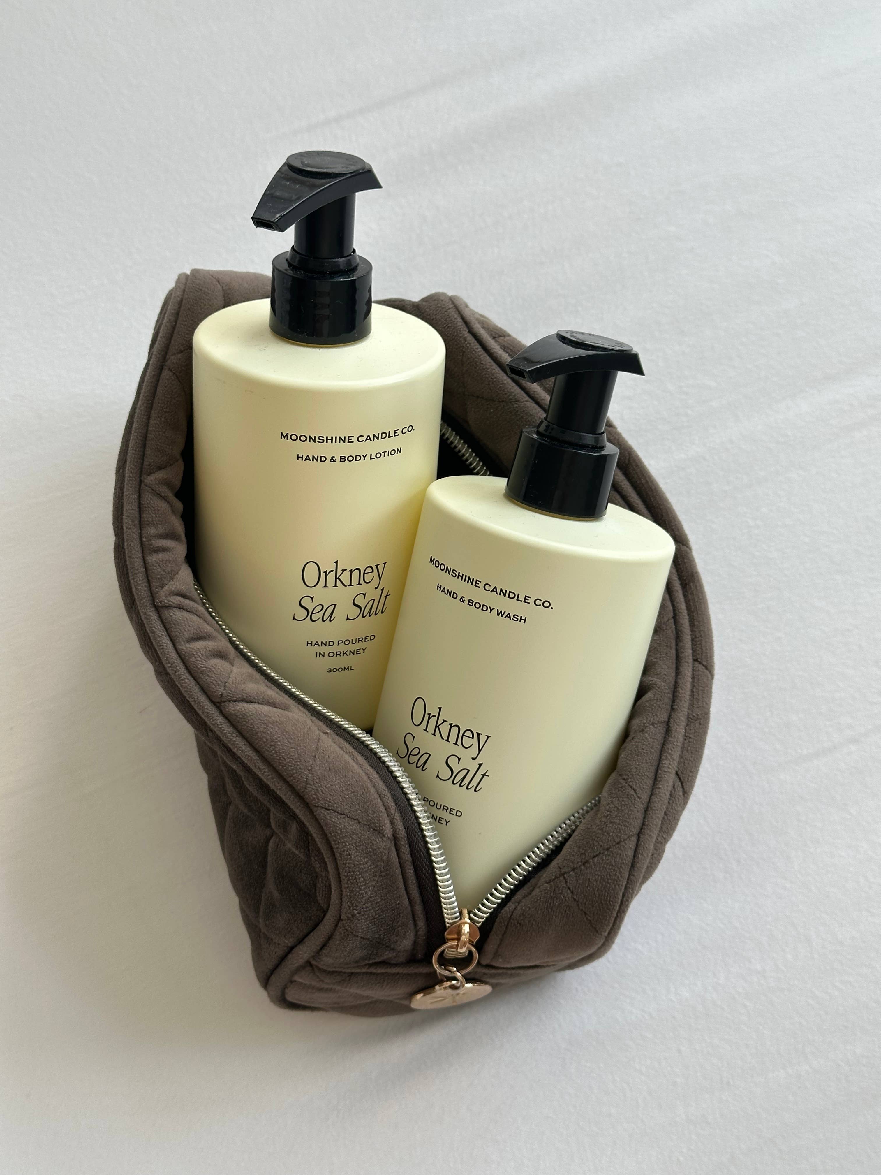 Two bottles of 'Orkney Sea Salt' soap in a brown pouch.