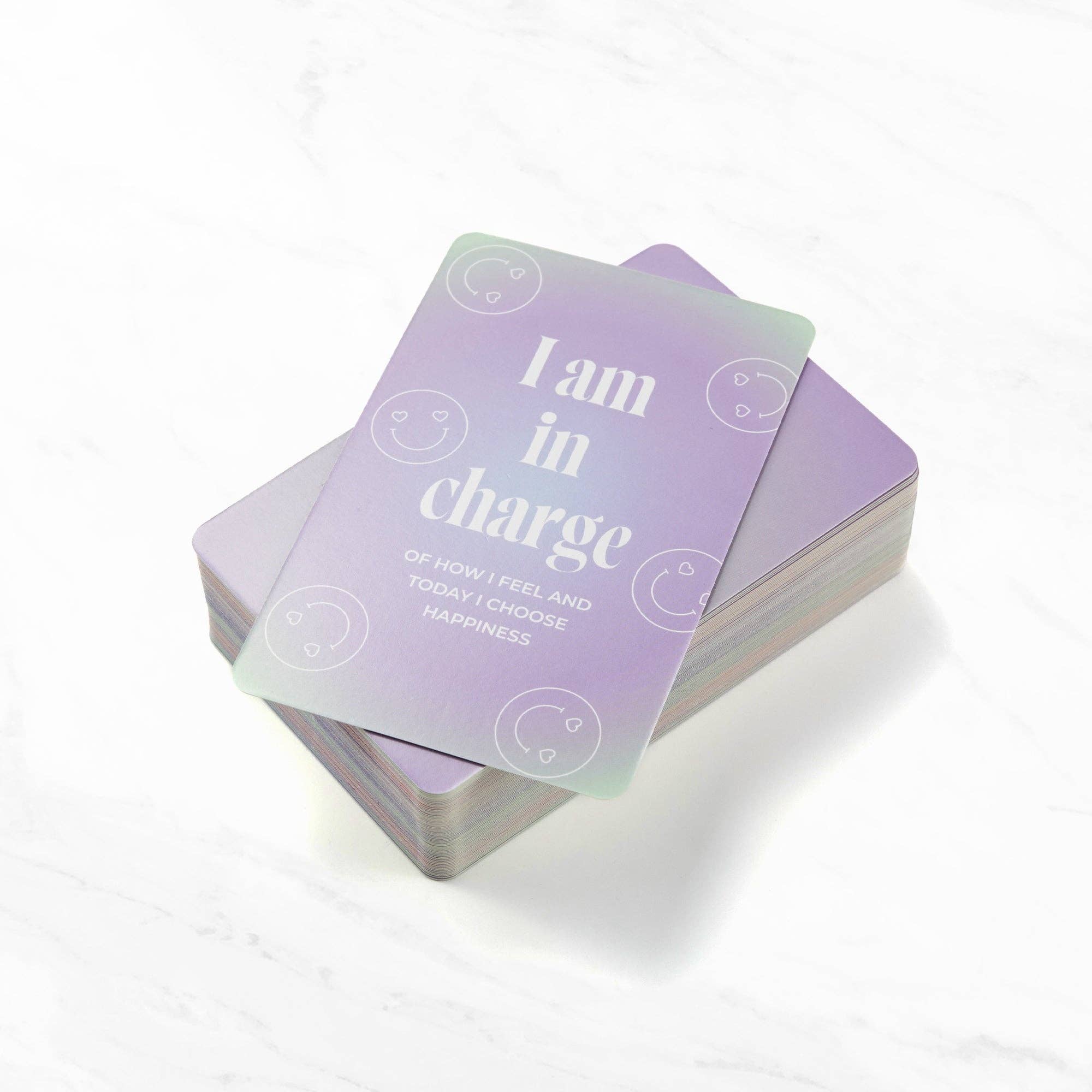 Stack of affirmation cards with motivational text.