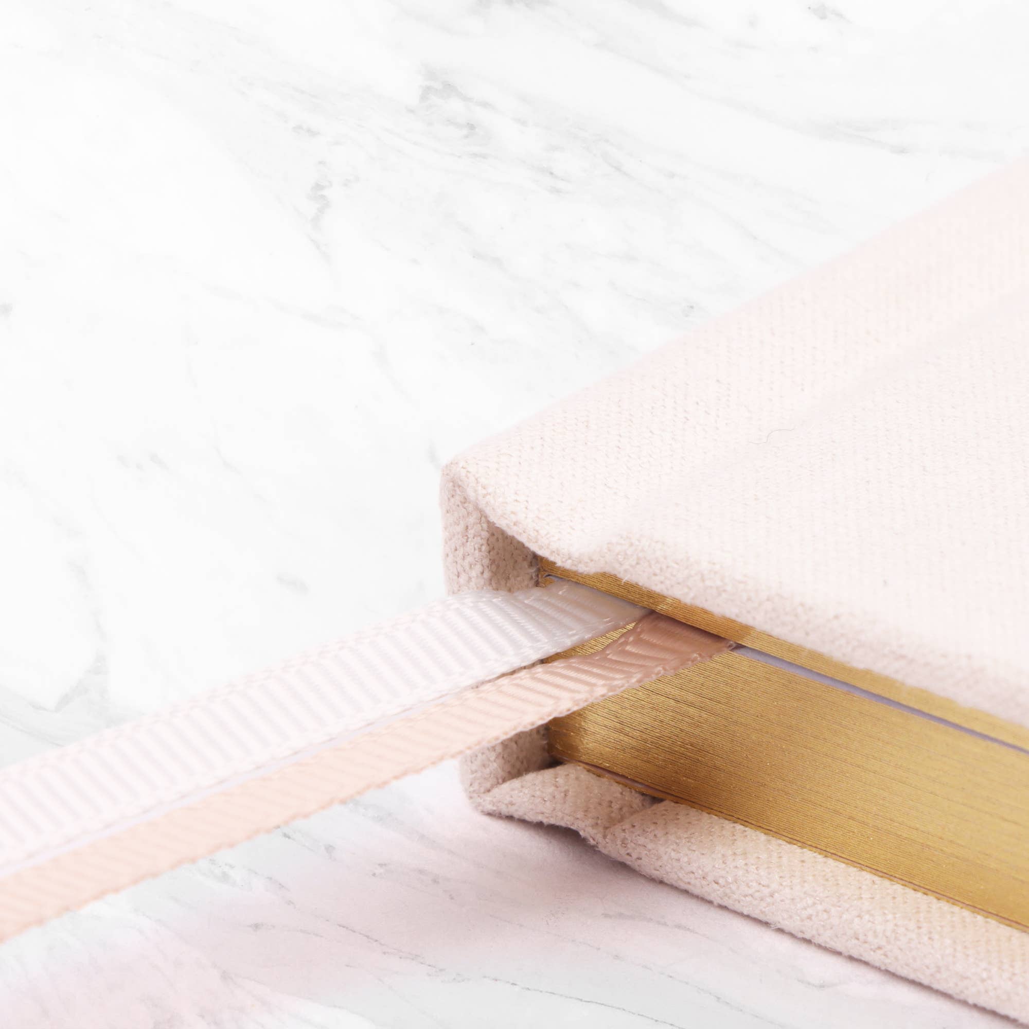 Close-up of a book with a gold spine.