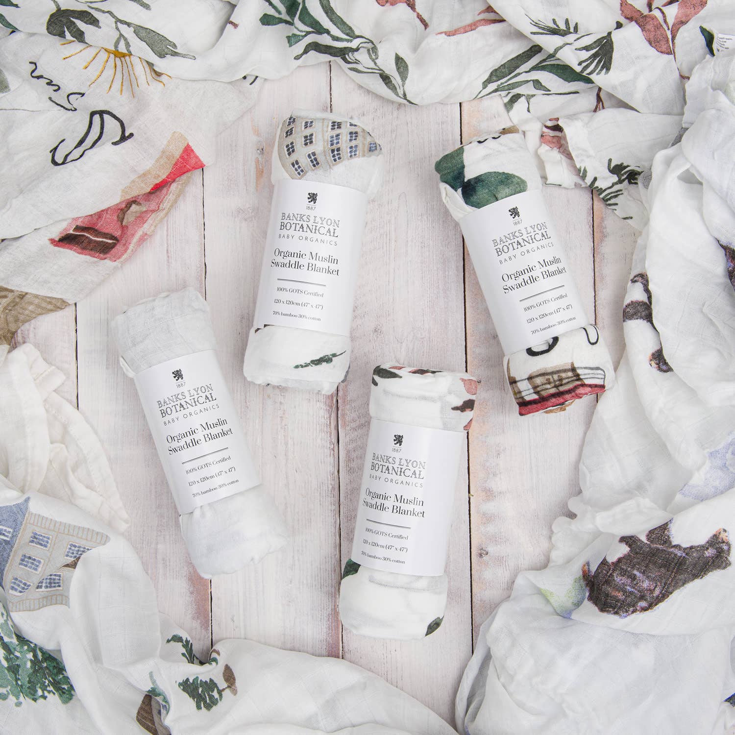Barefoot Botanicals hand cream tubes on a textured surface with floral patterns.