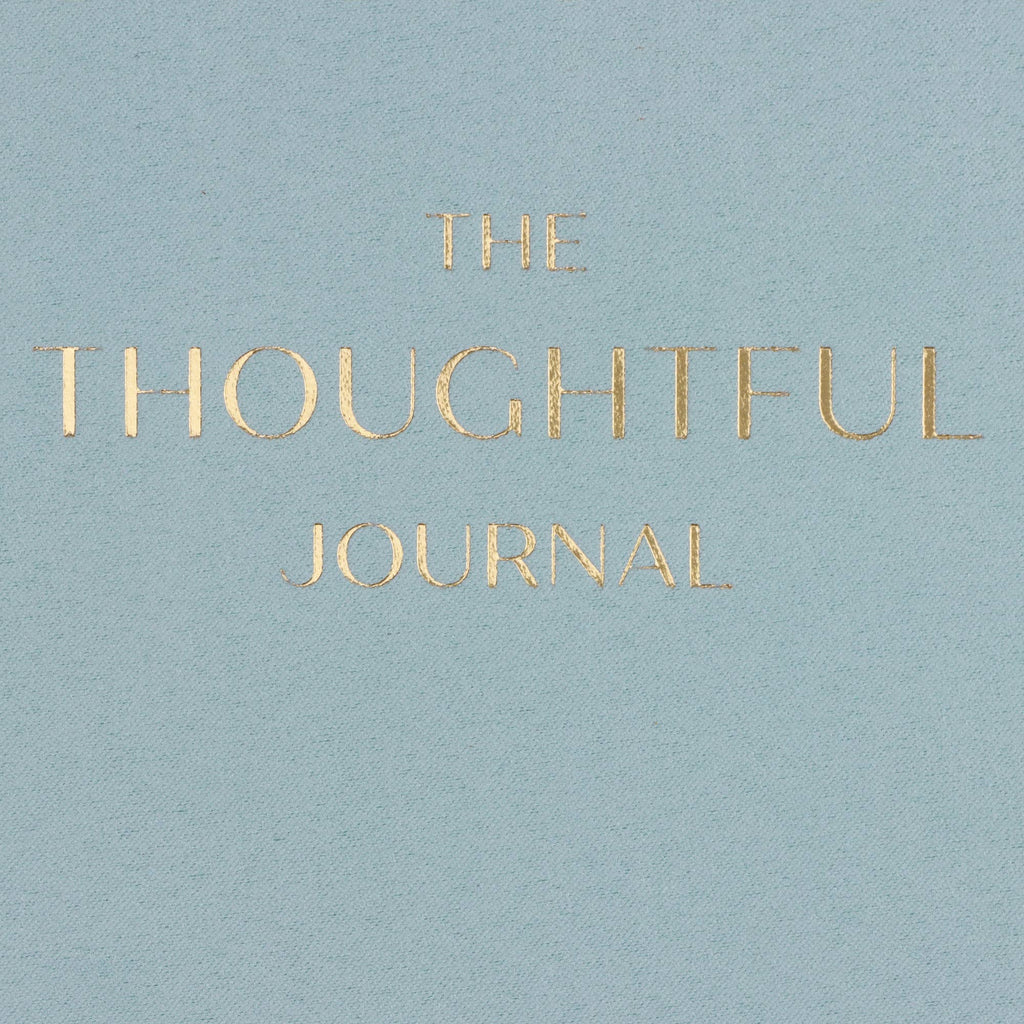 Light blue cover of 'The Thoughtful Journal' with gold text