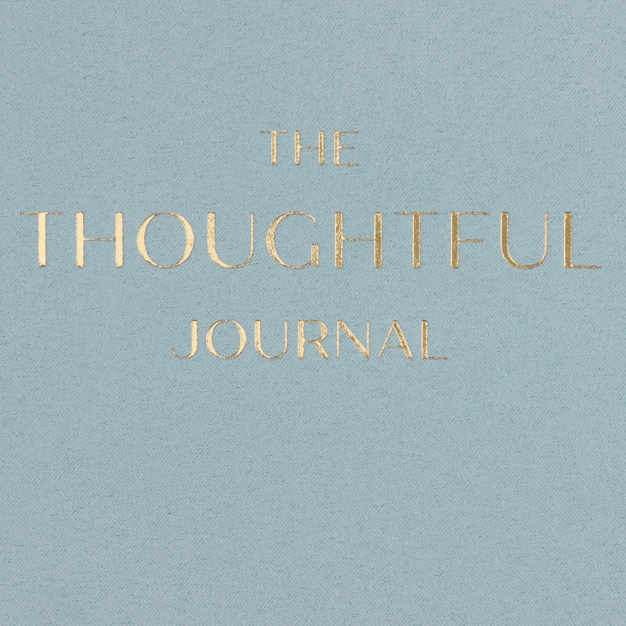 Light blue cover of 'The Thoughtful Journal' with gold text